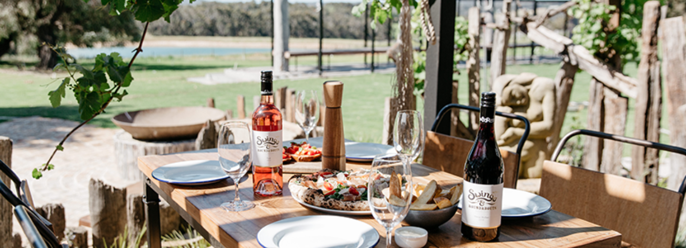 Table outside with Swings & Roundabouts wines and food 